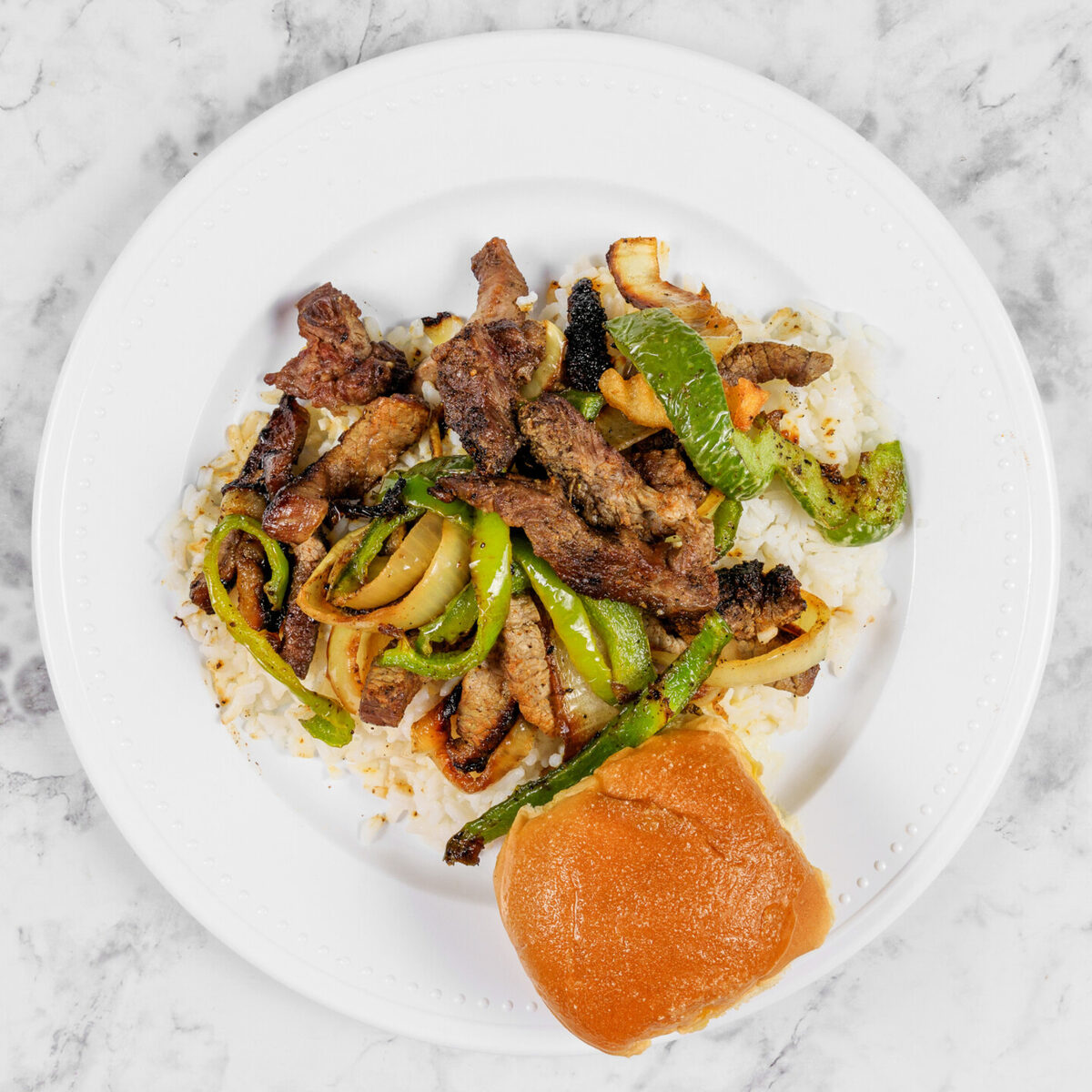 Slow cooked beef tips in gravy over hot rice